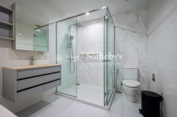 Modern bathroom with glass shower and toilet