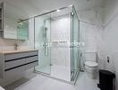 Modern bathroom with glass shower and toilet