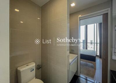 Modern bathroom with view into bedroom