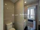 Modern bathroom with view into bedroom