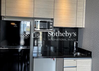 Modern kitchen area with built-in appliances