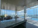 Indoor pool area with lounge chairs and city view