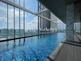 Modern building rooftop pool with city view