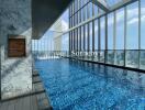 Indoor swimming pool with city view