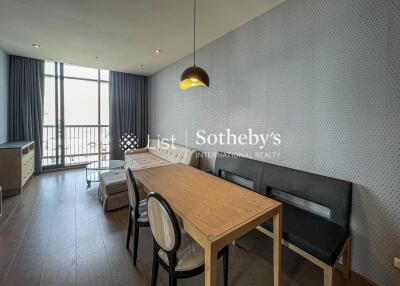 Modern living area with dining table and seating