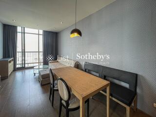 Modern living area with dining table and seating