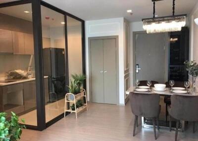 Modern dining area with adjoining kitchen