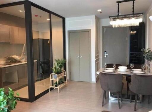 Modern dining area with adjoining kitchen