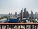 View from balcony overlooking city skyline