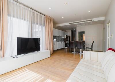 Bright living room with modern kitchen area