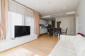 Bright living room with modern kitchen area