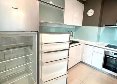 Modern kitchen with open fridge