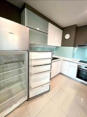 Modern kitchen with open fridge