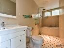 Modern bathroom with white fixtures and tiles