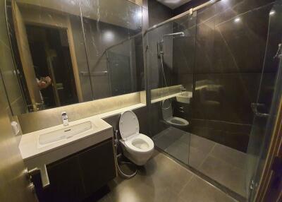 Modern bathroom with glass shower and toilet