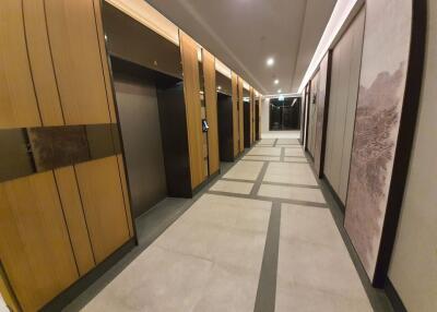 Modern apartment building hallway with elevators