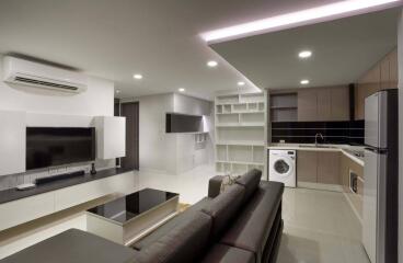 Modern living room with open kitchen