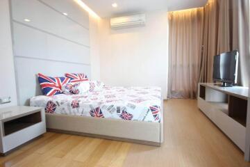 Modern bedroom with minimalist furniture and British-themed bedding