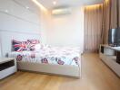 Modern bedroom with minimalist furniture and British-themed bedding