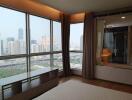 Bedroom with large windows and city view