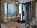 modern bathroom with glass-enclosed tub and shower