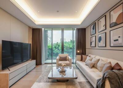 Modern living room with large TV and comfortable seating