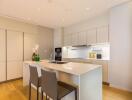 Modern kitchen with island and bar stools