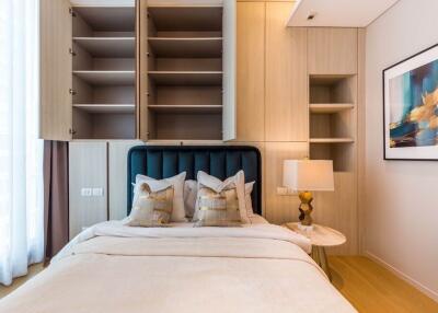 modern bedroom with built-in storage and stylish decor