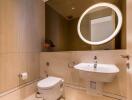 Well-lit modern bathroom with a wall-mounted sink and toilet