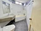 A modern bathroom with tiled walls and flooring