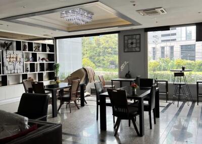 Spacious modern living area with large windows and natural light