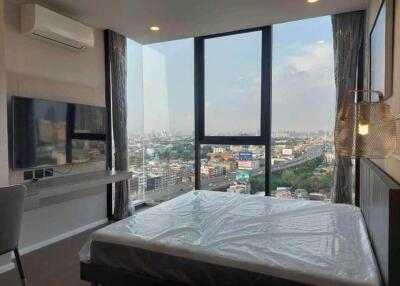 Bedroom with a view of cityscape