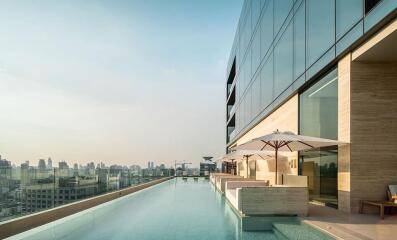 Luxury rooftop swimming pool with city skyline view