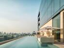 Luxury rooftop swimming pool with city skyline view