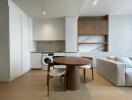 Modern kitchen and living area with dining table, built-in appliances, and open shelving