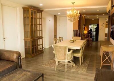 Elegant dining area with wooden furniture and chandelier