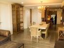 Elegant dining area with wooden furniture and chandelier