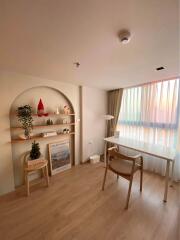 Cozy bedroom with desk and shelving