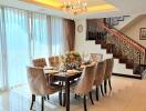 Elegant dining area with a chandelier and decorated dining table