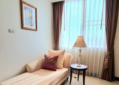 Living room corner with a chaise lounge and a side table