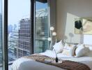 Bedroom with large windows and city view