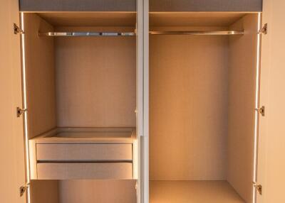 Open Closet with Shelves and Drawers