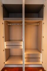 Open Closet with Shelves and Drawers