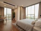 Spacious bedroom with large windows and natural light