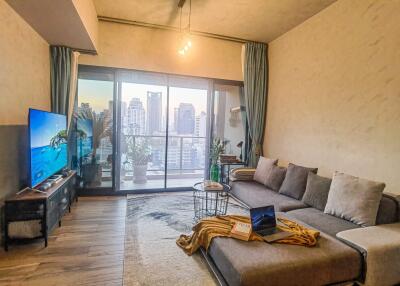 Modern living room with city view from a balcony