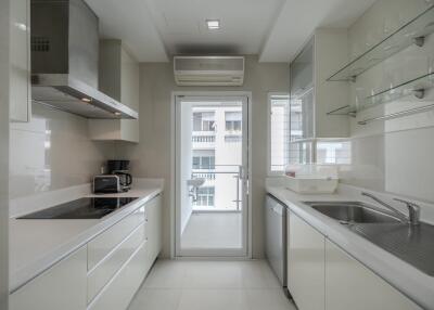 Modern kitchen with white cabinetry and appliances