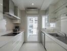 Modern kitchen with white cabinetry and appliances