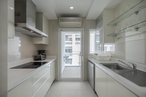 Modern kitchen with white cabinetry and appliances