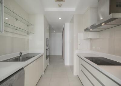 Modern white kitchen with built-in appliances