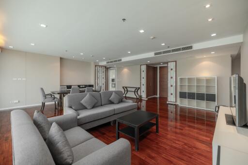 Spacious and modern living room with hardwood floors and comfortable seating